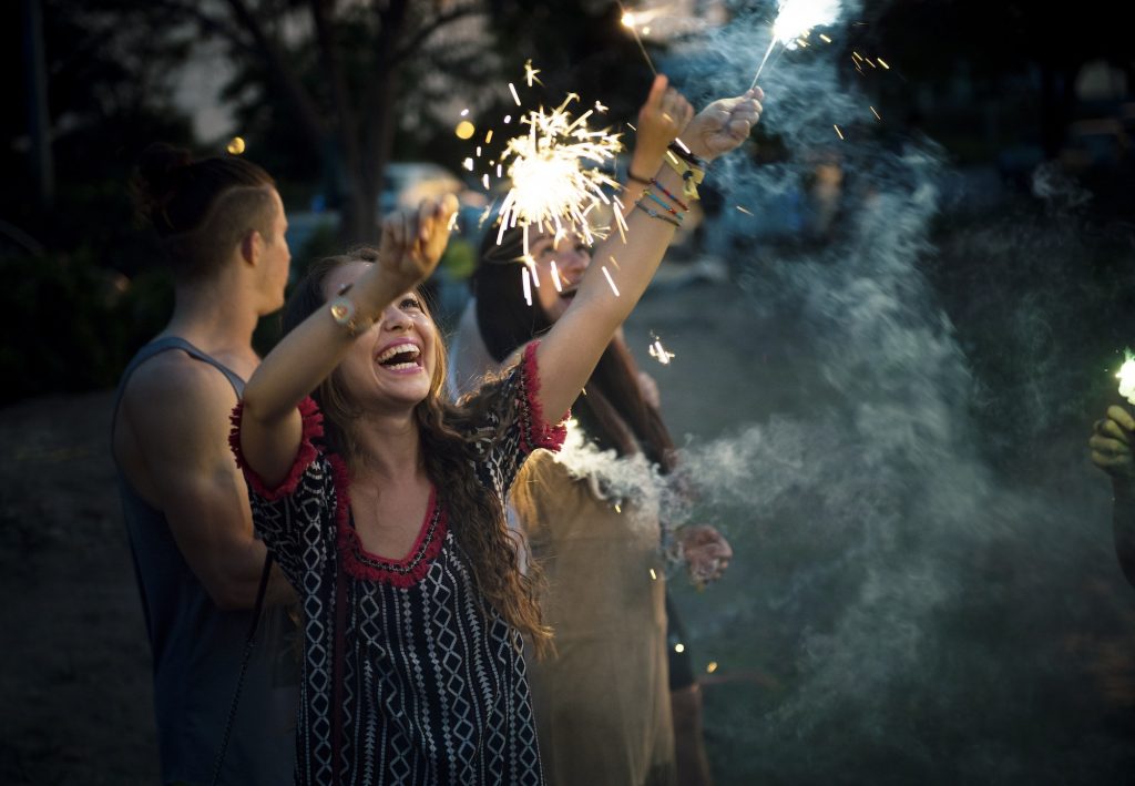 Woman Enjoying Sparkler in Festival Event
